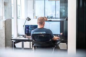 Someone typing at a computer screen at Reclaim.ai's office